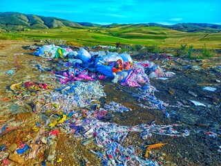 Environmental Pollution - Waste Dump in Green Landscape.
Plastic and Rubbish Mess - Nature...