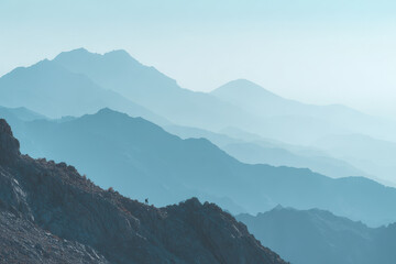 minimalist mountain ridge in pakistan under clear blue light featuring dramatic contrasts