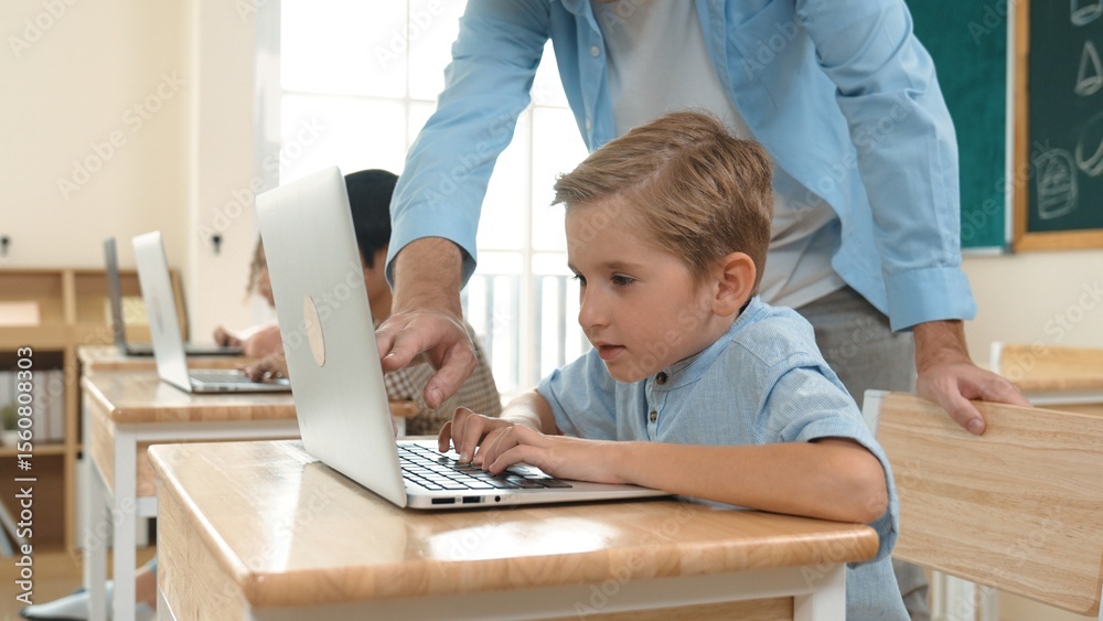 Poster caucasian teacher helping energetic boy coding engineering prompt while diverse student using softwa