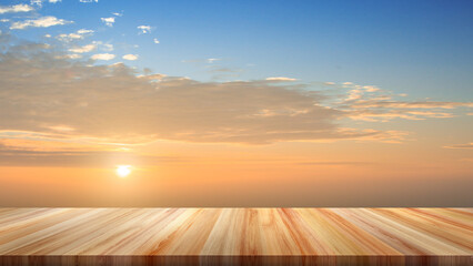 Top view of empty table as foreground with sunset and evening sky as background for displaying objects or showcasing products.