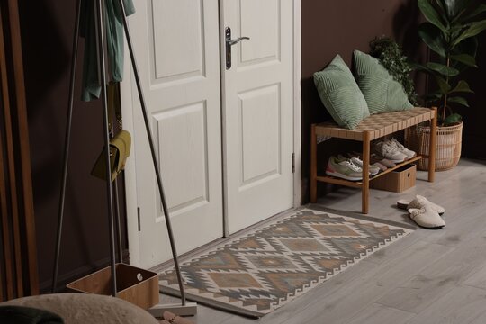 Different footwear and accessories in hallway indoors