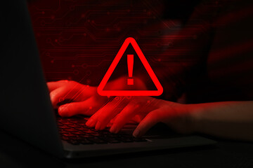 Cyber attack alert notification. Red warning sign, circuit board and photo of hacker using laptop