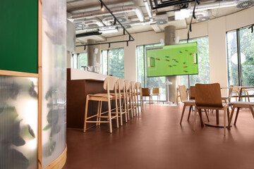 Broadcasting soccer match on TV set in bar, low angle view