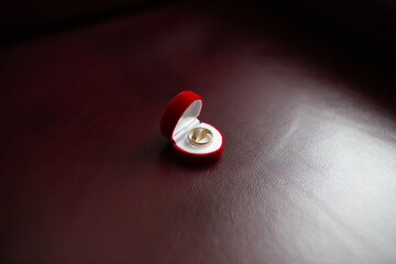 Golden Ring in Red Velvet Jewelry Box