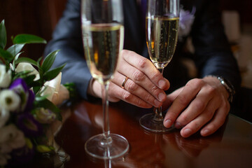 Hands Holding Champagne Flutes at Celebration