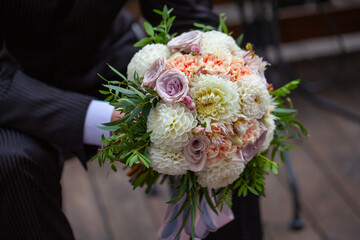 Beautiful bridal bouquet with roses and greenery