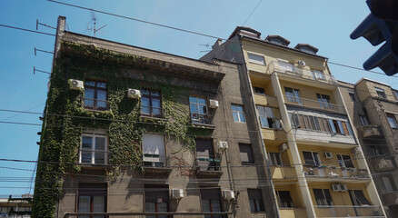 Facade of old building with windows.