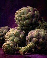 Obraz premium Fresh Organic Artichokes with Closed Buds and Green Leaves on Dark Background for Healthy Vegetarian Cuisine and Natural Food Display
