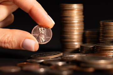 Saving money concept preset by Male hand putting money coin stack growing business