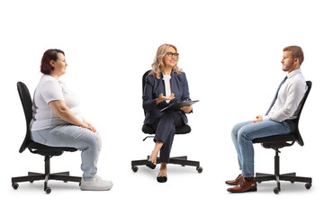 People sitting in office chairs and having a discussion