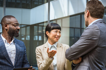 Multicultural business team having a discussion outdoor