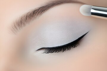 Close-up of a female eye with expertly applied makeup, showcasing a sleek eyeliner design and soft eyeshadow, highlighting beauty and precision in cosmetic artistry