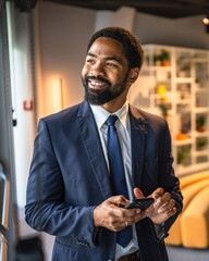african american businessman use mobile phone in the modern office