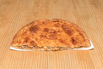 The secret to a perfect empanada is not to overfill the dough so