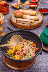 To avoid waste, cooked rice from the previous day was reused by frying it with leftover meat and vegetables.