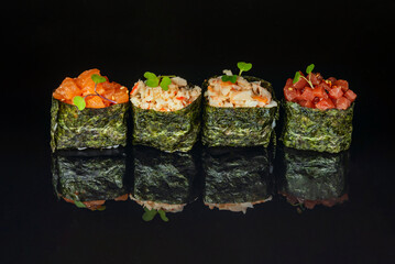 gunkanmaki is a form of maki where nori is used to hold the rice and a topping that couldn't hold up on nigiri