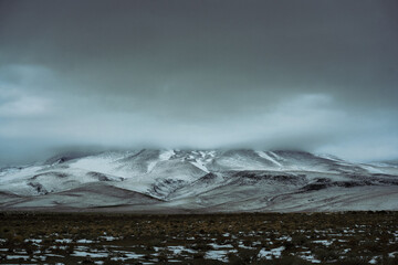 mountain landscape with clouds and snow