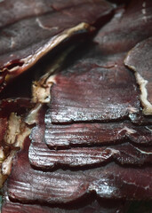 Dried beef slices prepared for preservation and an intense flavor experience