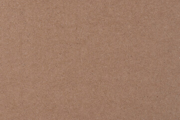 Plain brown textured cardboard sheet used for various crafts and packaging projects