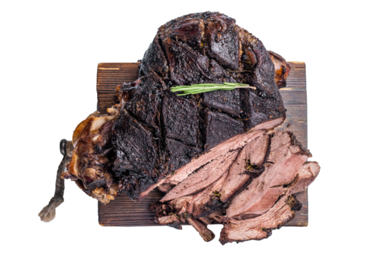 Slow ccoked sliced Venison leg, roasted game meat of deer on a board with herbs isolated on white background. top view