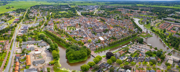 An panorama Aerial view of the old town of the  city Dokkum in the Netherlands on a sunny day in summer.	