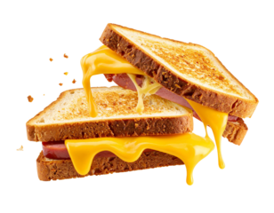 Two toasted sandwiches with melted cheddar cheese and ham falling on transparent background