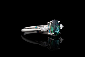 white metal ring, silver, gold with sapphire stone, diamonds on black background