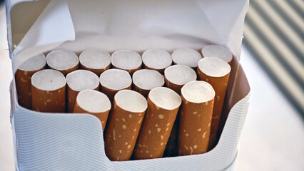Pack of cigarettes arranged neatly in a carton ready for sale at a convenience store