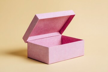 Open textured pink box with a partially raised lid on a plain yellow surface