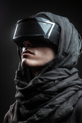 Head-and-shoulders portrait of techwear model in black visor helmet, light glowing from beneath, neck layered in tactical scarf futuristic helmet reflections