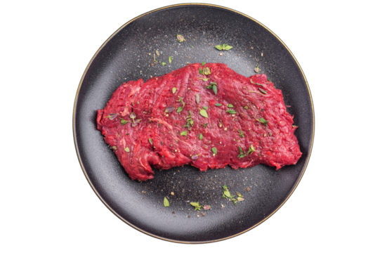 Marinated Flank or Flap steak, raw beef meat with thyme and spices on plate isolated on white background. top view