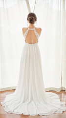 Fototapeta premium Elegant Bride Standing in Front of Bright Window Curtains