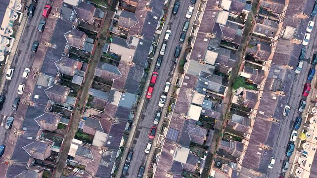 Aerial reveal of large housing estate with terraced houses in UK