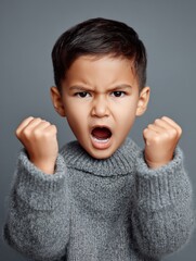 Joyful Child Portrait with a Bright Smile in a Woolen Sweater