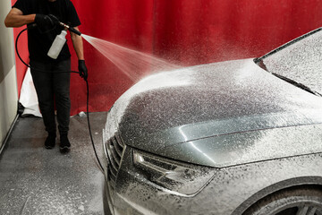 High-pressure snow foam application ensures deep cleaning and softens grime on car surface. Car...