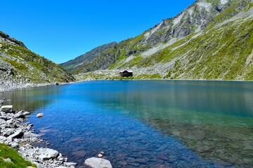 Mountain hut at the shore of Dösner mountain lake in High Tauern mountains, Carinthia, Austria