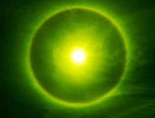 rare phenomenon created when sunlight hits ice crystals suspended high in the atmosphere, circular halo around the sun