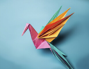 A colorful origami bird is flying in the air