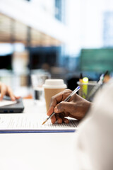 Recruiter filling document files after finding best talent to fill open company position. Close up...
