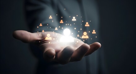 Person's hand holding glowing network.