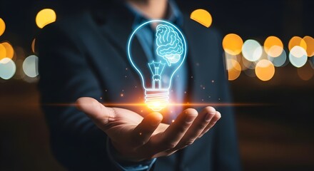 Person holding a glowing lightbulb with a brain inside, symbolizing a new idea.