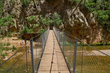 Footbridge, rope suspension bridge over the river Turia