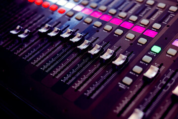 Concert sound mixer panel with volume regulators. Professional audio and light equipment for sound...