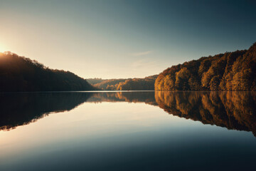 serene lakeside scene at sunset where golden rays reflect on calm water