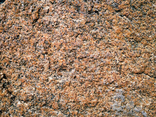 Natural light brown rock background. Stone texture. Grunge granite surface.
