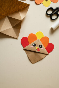 DIY origami turkey - bookmark craft gift for thanksgiving day. paper craft for kids. create art for children. autumn background with copy space