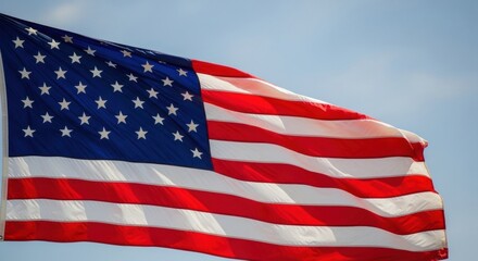 Obraz premium Close-Up of a Bright American Flag Waving Under a Clear Sky