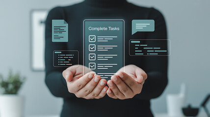Person holding a digital screen displaying complete tasks with checkmarks and other icons