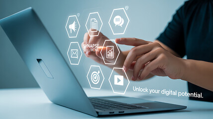Person interacting with digital icons on a laptop screen for synapse solutions company