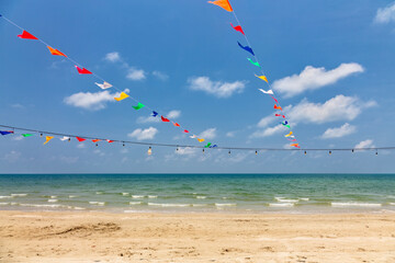 Colorful flags on a beautiful tropical beach on Koh Chang island